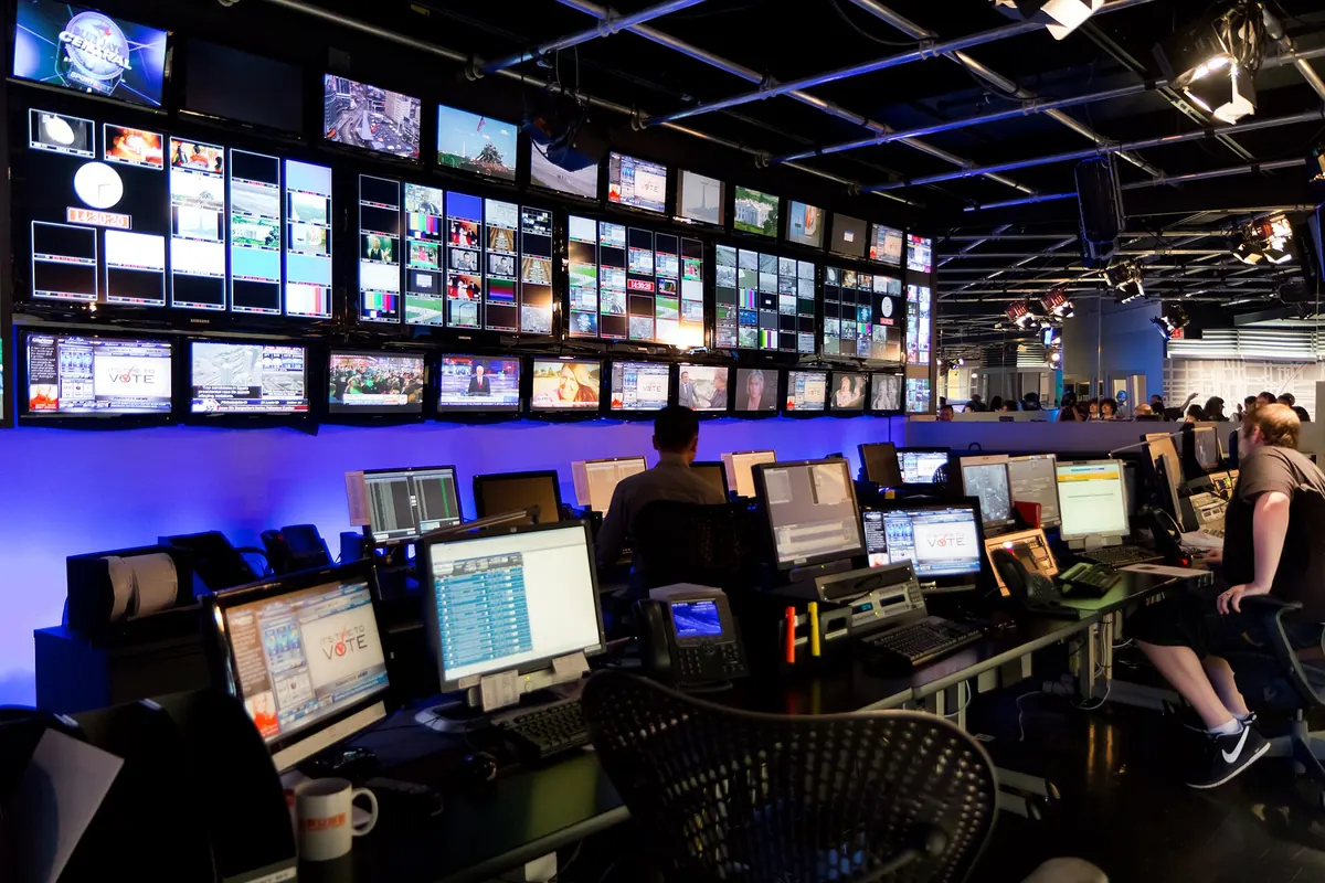 A broadcast control room with many monitors, where TV channels are prepared before being sent over IP networks