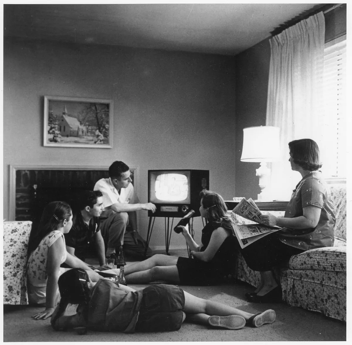 A 1958 family watching a television set together, a reminder of how TV viewing worked before internet delivery