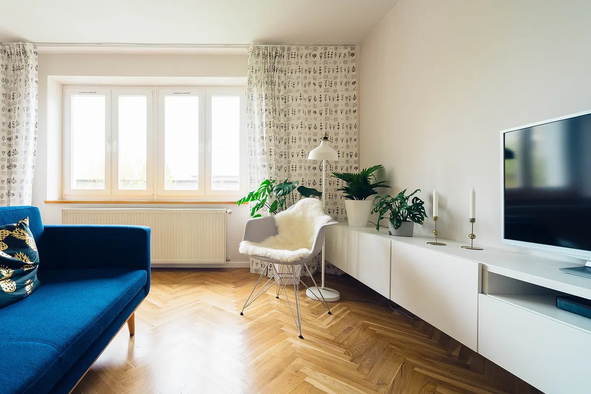 Smart TV on a stand in a bright living room