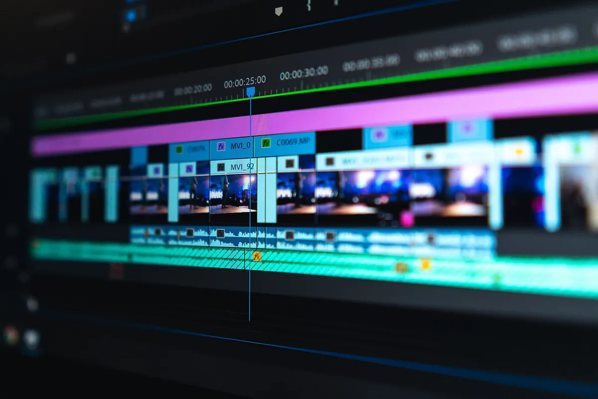 A video editing timeline on a monitor, showing the kind of footage an encoder compresses into an IP stream