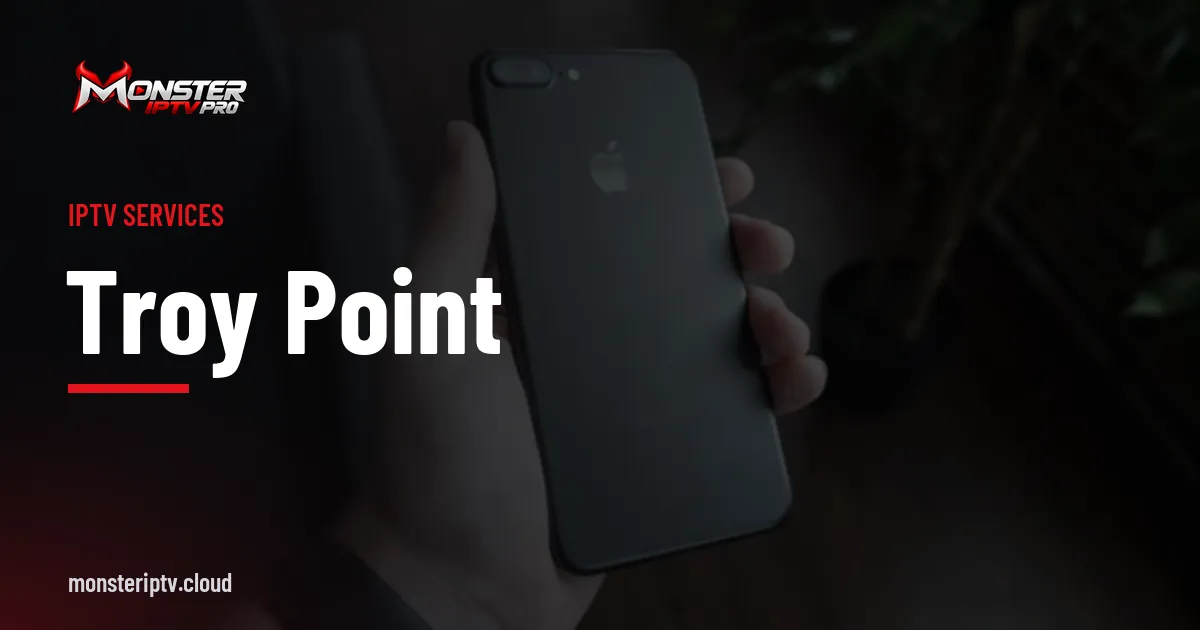 Troy Point banner over a black smartphone on a desk